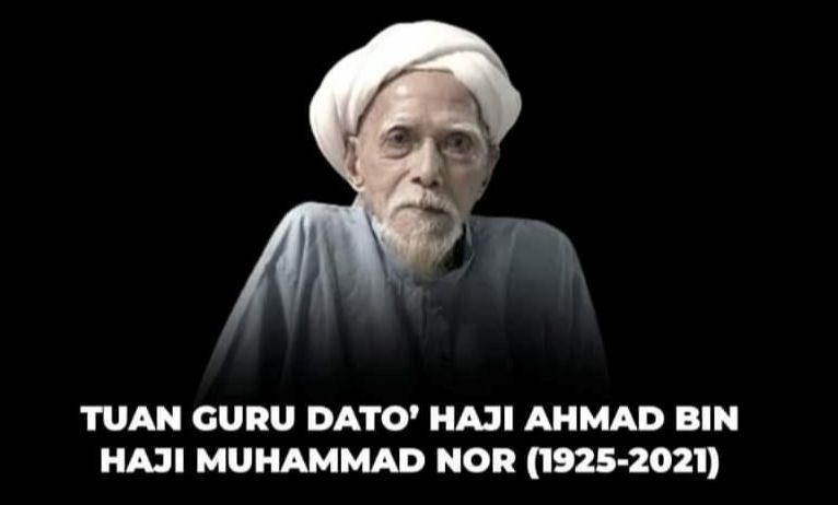Death announcement of Tuan Guru Dato' Haji Ahmad Bin Haji Muhammad Nor (1925-2021). He is pictured wearing a white turban and has a white mustache and goatee.