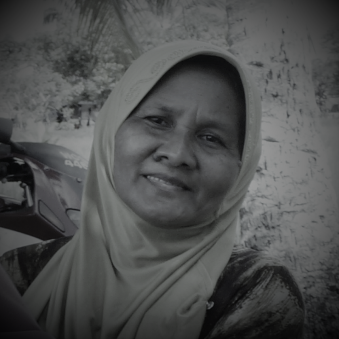 Siti Ashah Binti Awang is smiling. She wears a headscarf.