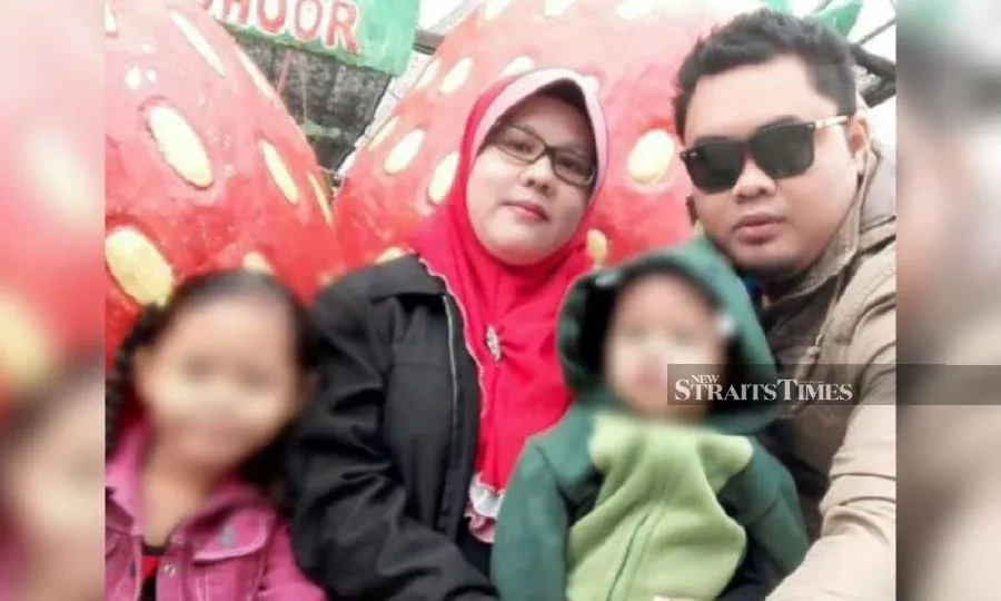 Nurizuwan Omar with his wife and children during a holiday. 
